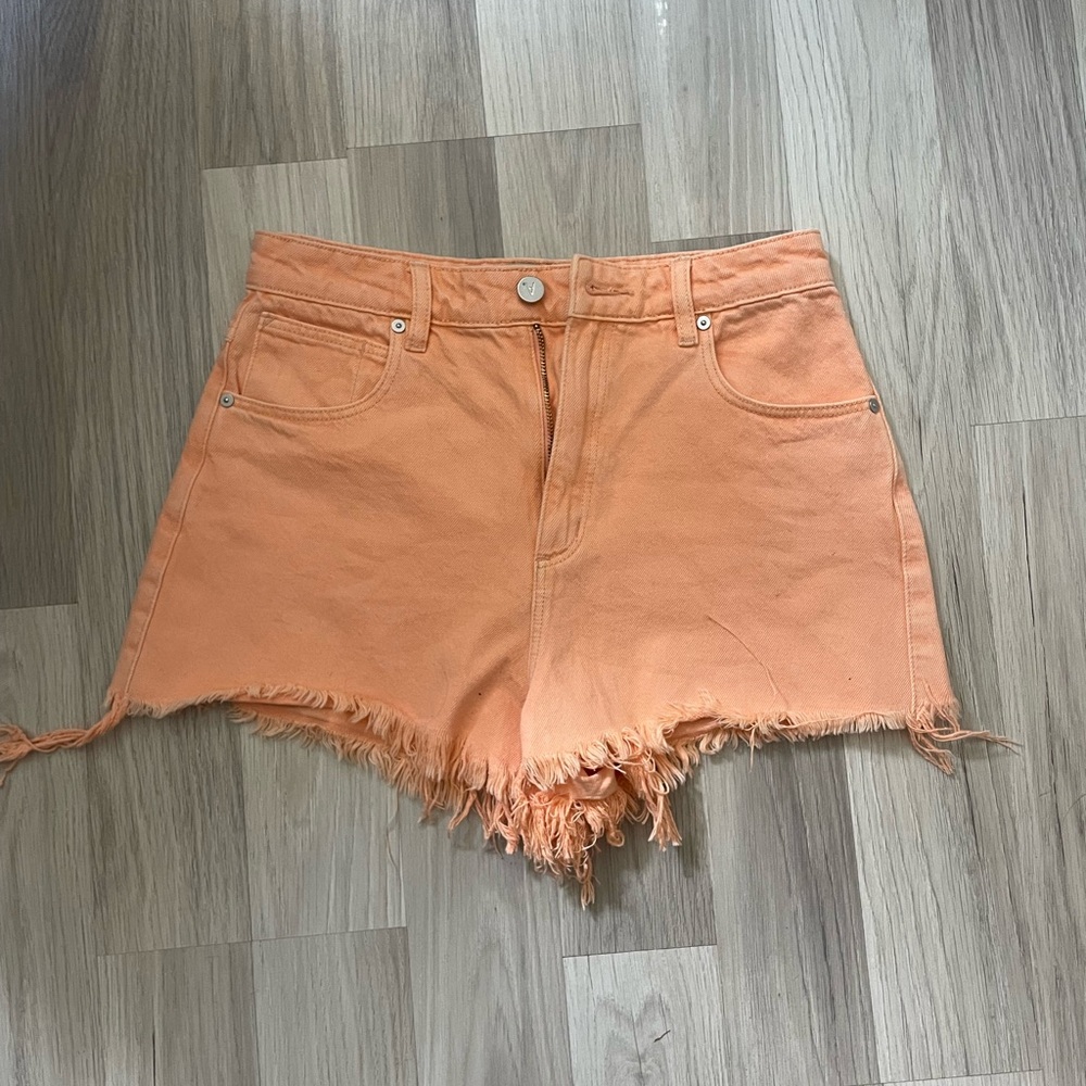 Orange cutoff jean shorts
